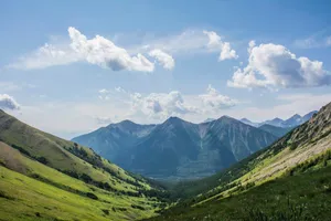 green mountains under white clouds during daytime jigsaw puzzle