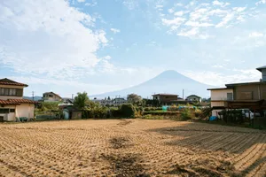 Mount fuji seen from a residential area with a field. jigsaw puzzle