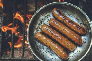 cooked sausage on round grey pan jigsaw puzzle