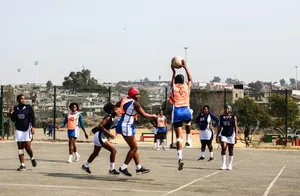 A group of young men playing a game of basketball jigsaw puzzle