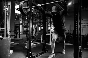a man is doing a pull up in a gym jigsaw puzzle