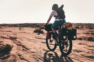 man in black shirt riding on black mountain bike during daytime jigsaw puzzle