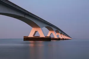 white bridge over body of water jigsaw puzzle