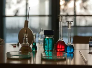 A table topped with flasks filled with liquid jigsaw puzzle