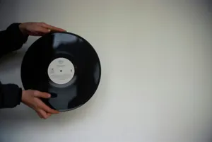 a person holding a black object jigsaw puzzle