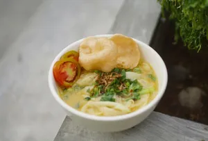 a bowl of soup with a piece of bread on top of it jigsaw puzzle