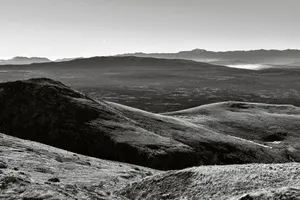 Explore the vast mountainous terrain in Prisoje, Bosnia and Herzegovina, captured in striking black and white. jigsaw puzzle
