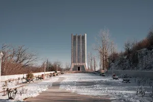 Snow-covered Vagif Mausoleum in a serene park setting, Azerbaijan. jigsaw puzzle