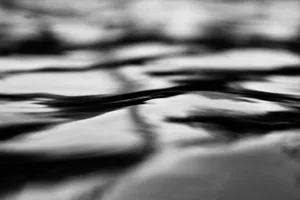 a black and white photo of a bed jigsaw puzzle
