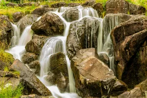water falls on brown rock jigsaw puzzle