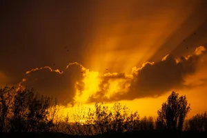 The sun is shining through the clouds in the sky jigsaw puzzle