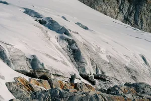 a snow covered mountain with rocks and snow jigsaw puzzle