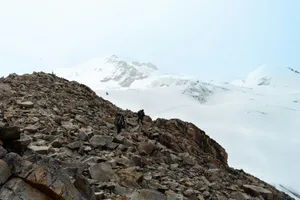 a group of people hiking up a rocky mountain jigsaw puzzle
