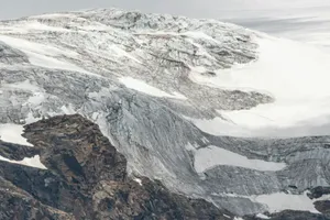 Snow-capped mountain with rocky peaks and a glacier. jigsaw puzzle