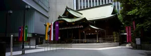 Traditional japanese shrine nestled among modern city buildings. jigsaw puzzle