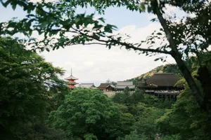 Japanese pagoda and temple buildings nestled in green trees. jigsaw puzzle