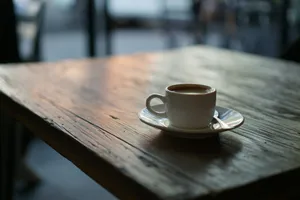 white ceramic cup on saucer on top of wooden table jigsaw puzzle
