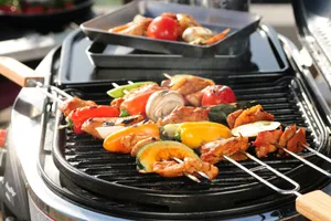 a close up of a grill with meat and vegetables on it jigsaw puzzle
