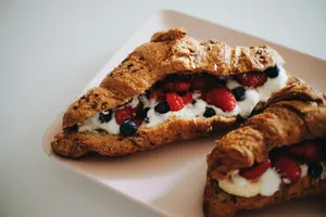 a pastry with berries and cream on top of it jigsaw puzzle