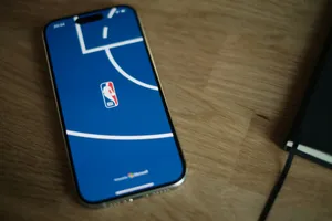 A cell phone sitting on top of a wooden table jigsaw puzzle
