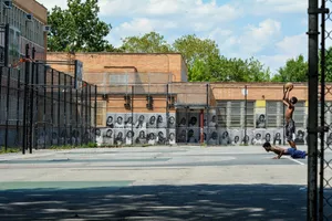 cars parked in front of brown building during daytime jigsaw puzzle