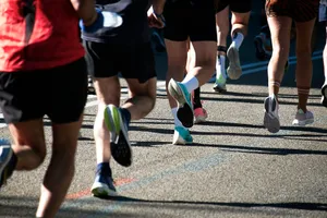 a group of people running down a street jigsaw puzzle
