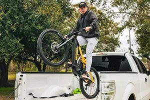 A man doing a trick on a bike on the back of a truck jigsaw puzzle