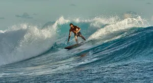 man in black shorts surfing on sea waves during daytime jigsaw puzzle