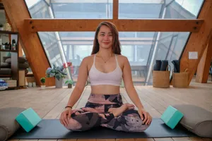 woman in white sports bra and black and gray camouflage pants sitting on gray yoga mat jigsaw puzzle