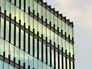 Modern glass building facade reflecting the sky jigsaw puzzle