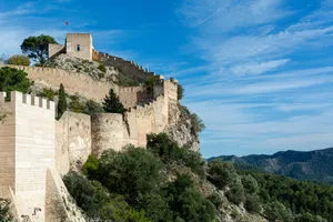 brown concrete castle on top of mountain during daytime jigsaw puzzle