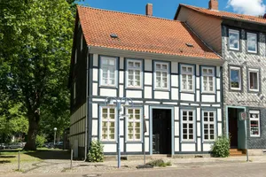 A historic half-timbered house with a red roof. jigsaw puzzle