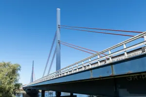 Modern cable-stayed bridge under a clear blue sky jigsaw puzzle