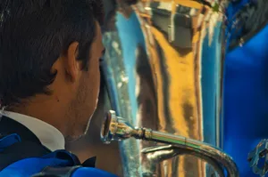 a close up of a person holding a trophy jigsaw puzzle