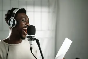a man wearing headphones singing into a microphone jigsaw puzzle