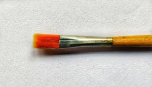 a close up of a paint brush on a white surface jigsaw puzzle