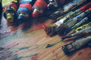 three paint tubes near paint brushes jigsaw puzzle