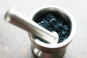 a metal cup filled with a blue substance jigsaw puzzle