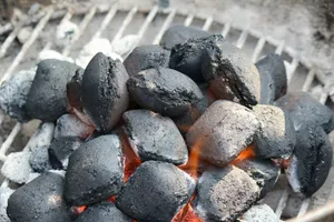 a close up of a grill with hot coals on it jigsaw puzzle