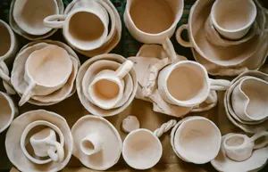 A bunch of cups that are sitting on a table jigsaw puzzle