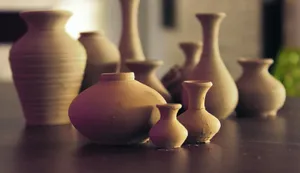 brown ceramic vases on wooden surface jigsaw puzzle