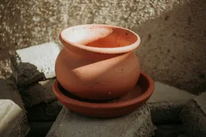 brown clay pot on gray concrete jigsaw puzzle