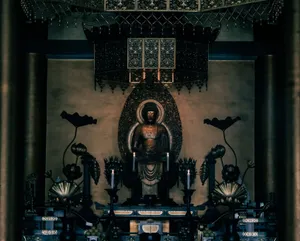 Dramatic view of a Buddha statue in a Kyoto temple, capturing the tranquil essence of Japanese spirituality. jigsaw puzzle