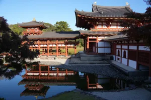Serene landscape of Byodo-In Temple reflecting in a calm pond under clear daylight in Uji, Kyoto. jigsaw puzzle