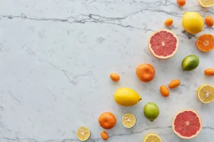 Colorful assortment of sliced citrus fruits on marble background, offering fresh and healthy vibes. jigsaw puzzle