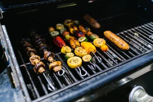 Colorful skewers with vegetables and sausages grilling on an outdoor barbecue. jigsaw puzzle