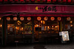 Cozy Japanese restaurant with red lanterns, inviting warm lights, and Asian signage. jigsaw puzzle