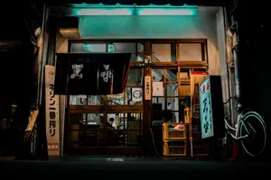A neon-lit traditional izakaya facade in Osaka, showcasing Japanese cultural elements and vibrant street life. jigsaw puzzle