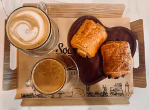 Delicious coffee and croissants served on a stylish tray, perfect for breakfast. jigsaw puzzle