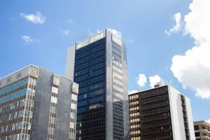 Contemporary high-rise buildings in Puerto Rico's cityscape under a bright blue sky. jigsaw puzzle